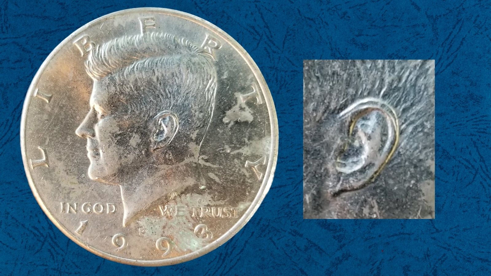Extreme close-up of Kennedy's earlobe on a 1993 half dollar showing the Doubled Ear variety with subtle secondary impression on the lower ear